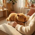 Huggo Weighted Capybara resting on a lap on a beige couch — weighted capybara plush 65cm 1kg